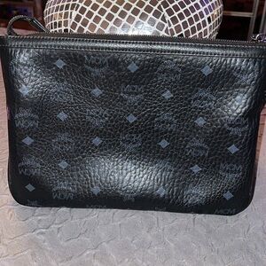 Preloved MCM clutch great condition has some wear on leather from us no scratch